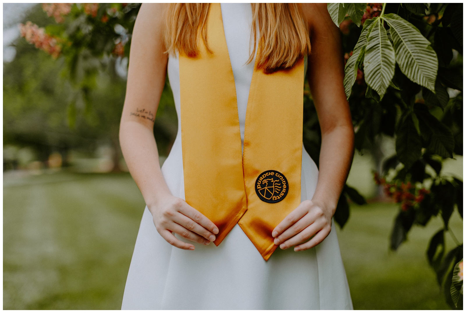 I love a close-up photo of a graduation stole! The seal makes a fun feature for Purdue graduation photos.